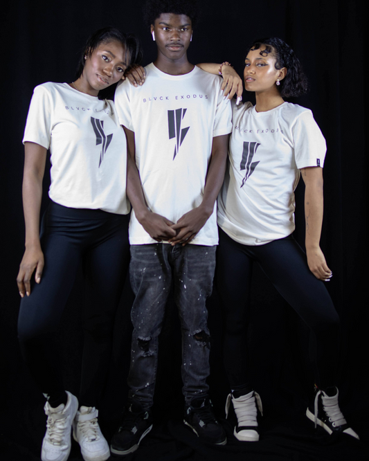 One male and two females wearing the vintage white t shirt White short-sleeve t-shirt featuring a minimalist black lightning bolt graphic and the Blvck Exodus logo in a bold font