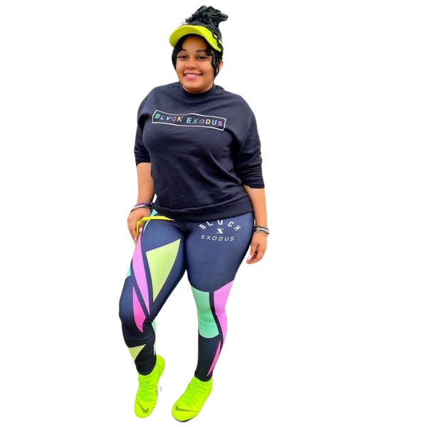 female wearing  colorful retro design Black crewneck sweatshirt and matching leggings, Black sweatshirt, Blvck Exodus, streetwear, urban fashion, Christian apparel, colorful design, repeated text
